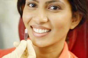 dental implants in lancaster - one girl is using dental implants service